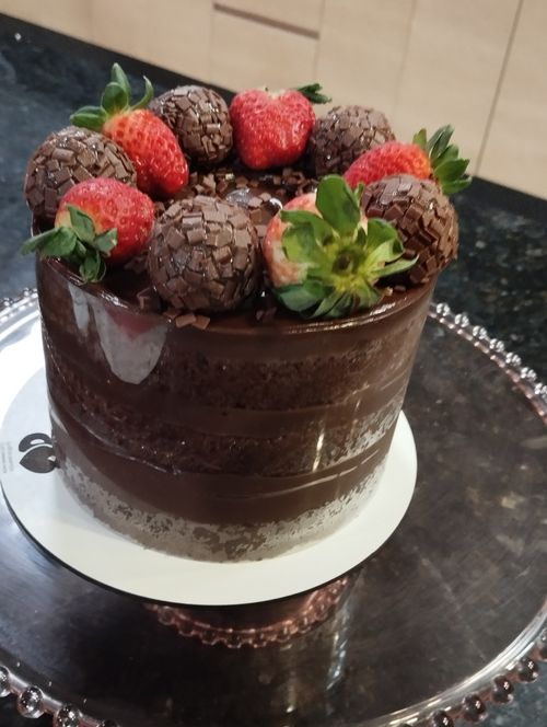 Free Chocolate cake decorated with strawberries Stock Photo