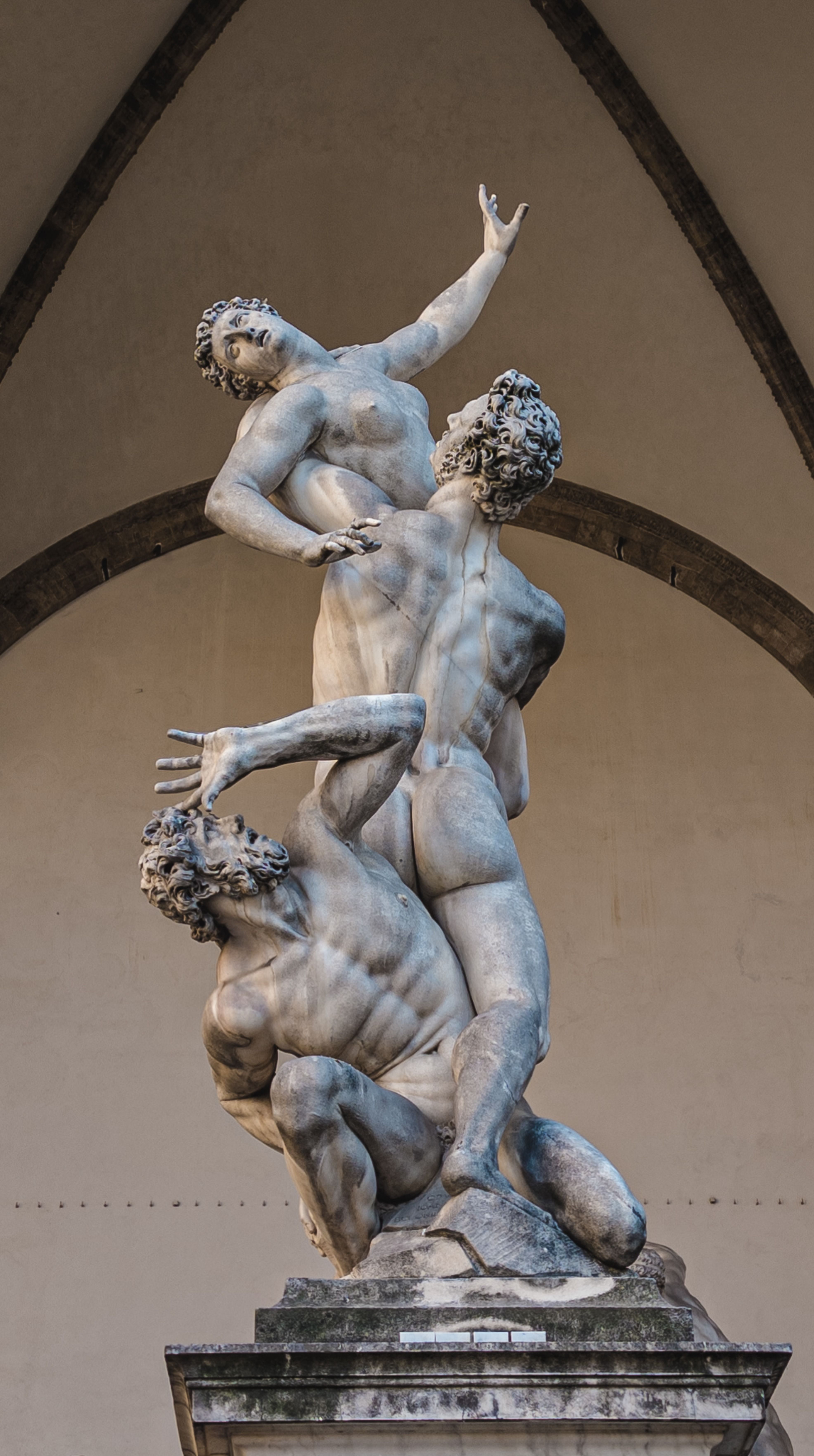 Close-up of the iconic 'Rape of the Sabine Women' sculpture in Florence, Italy.