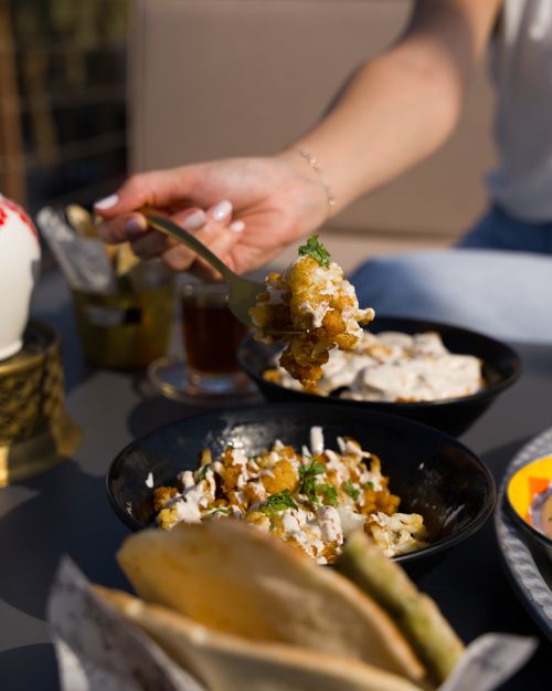 Free Enjoying a delicious meal during an outdoor dining experience in the sun. Stock Photo