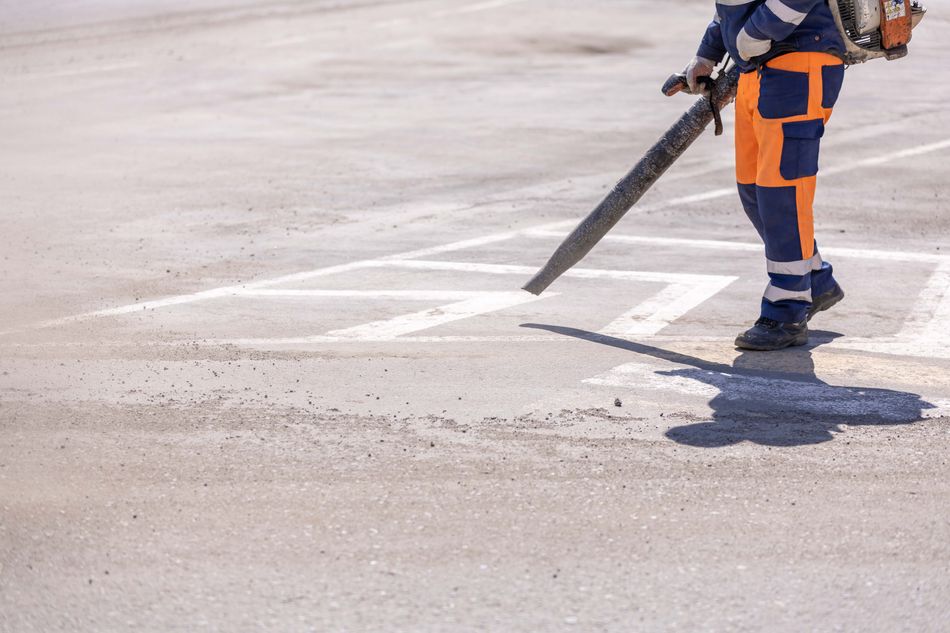 Illustrative stock photograph of a worker clearing a construction site