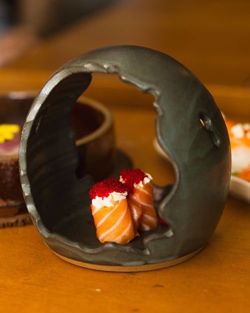 Free Gourmet sushi beautifully presented in a unique ceramic dish, ideal for menus and culinary blogs. Stock Photo