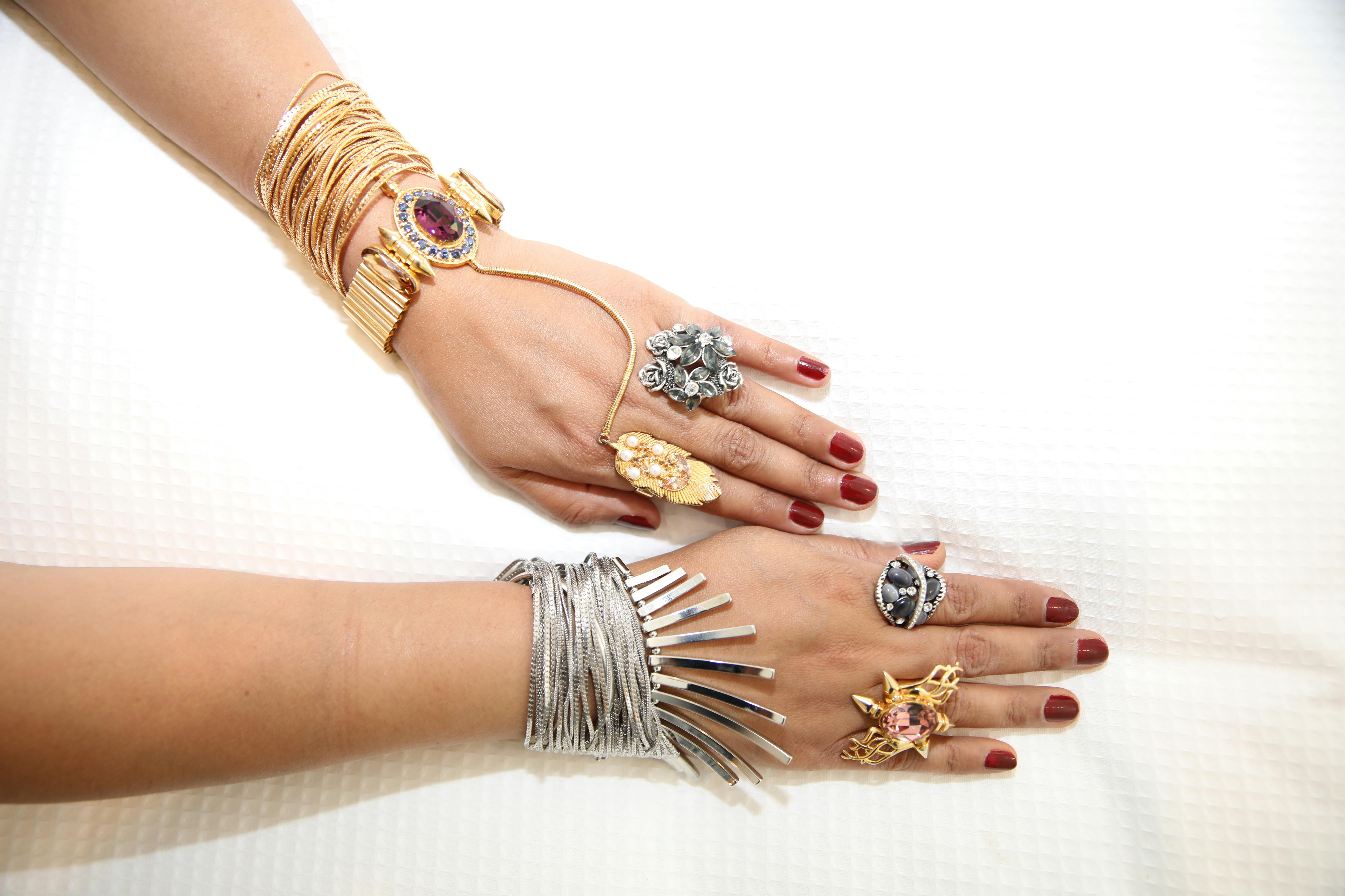 Terracotta Nail Polish On Hands With Gold Jewelry