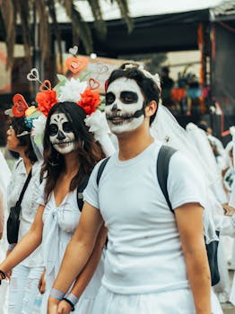 Participants with face paint walk in Day of the Dead festival, Mexico City.