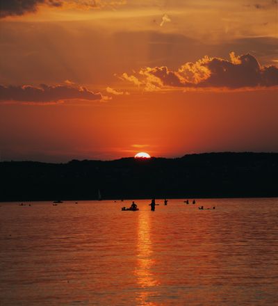 Sun setting over open water, photo by Molnar Tamas Photography on Pexels