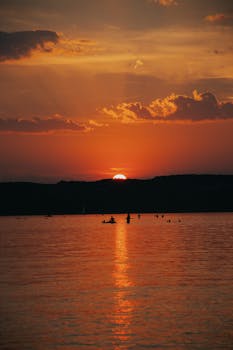A captivating sunset over a tranquil lake in Hungary, capturing the serene beauty of nature.