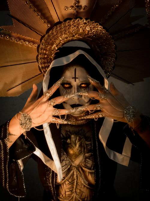 Free Creepy nun costume with detailed horror makeup, ideal for Halloween themes. Stock Photo
