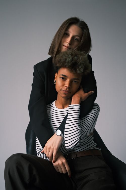 Free Tender portrait of a young couple embracing, showcasing modern fashion. Stock Photo