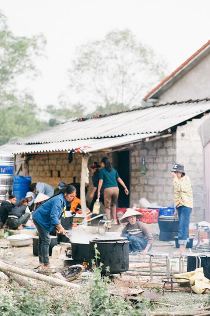A vibrant outdoor cooking scene in Lạng Sơn, Vietnam, depicting local culture and community.