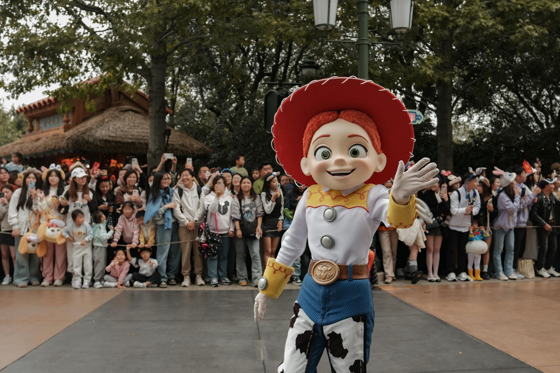 A vibrant Toy Story character parade at Shanghai Disneyland, featuring enthusiastic crowds and lively atmosphere.