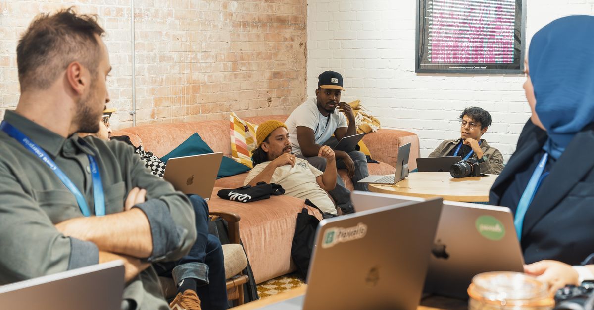 A real photo of a digital marketing team collaborating in a modern office