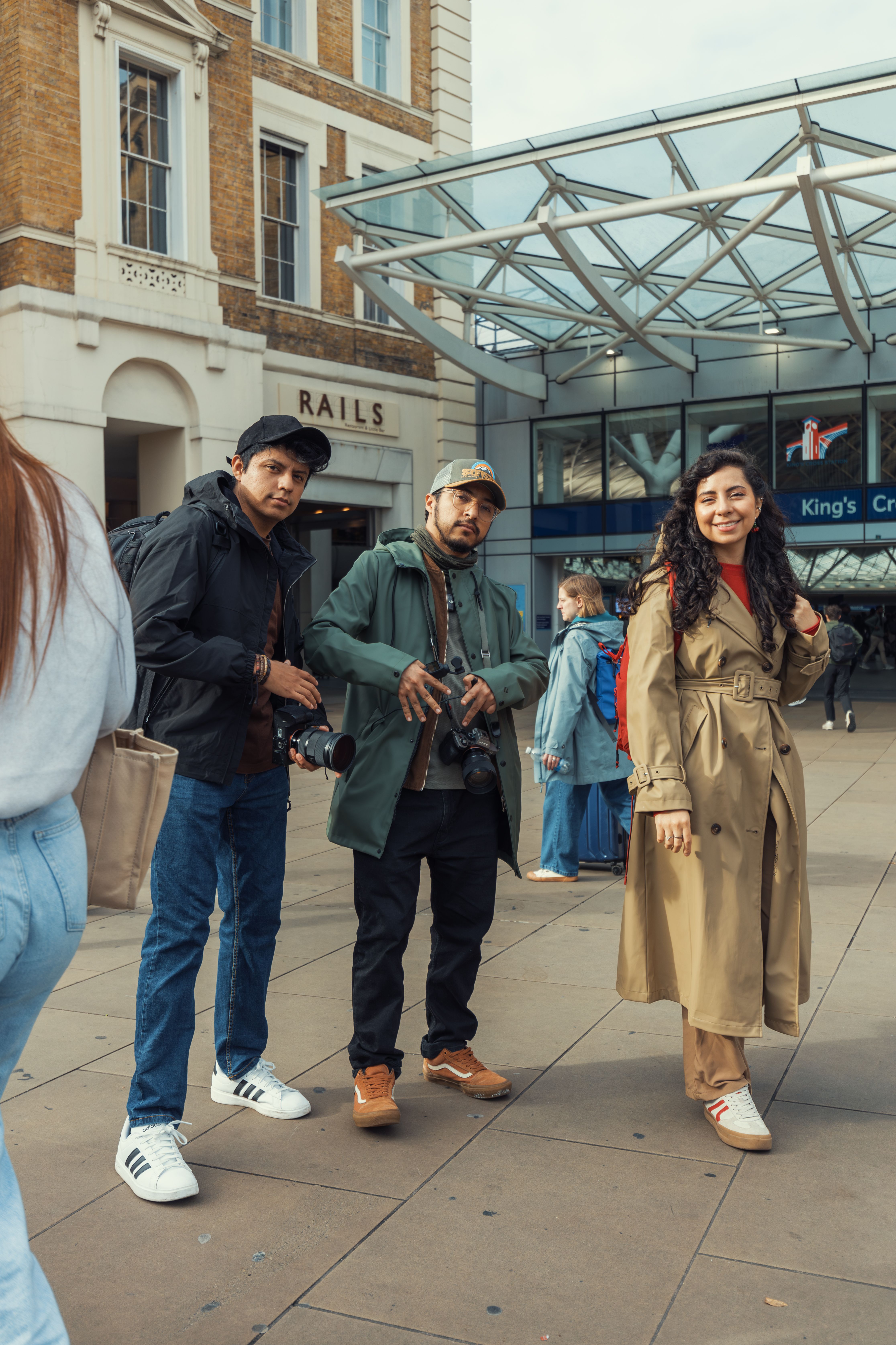 Group of friends enjoying a day out at King's Cross Station, London.