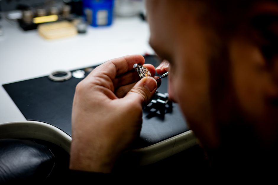 Withings ScanWatch 2 vs Apple Watch: Health Monitoring Showdown (2024) A watchmaker skillfully working on a mechanical watch in a workshop, showcasing precision and craftsmanship.