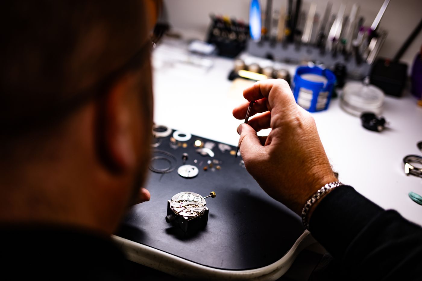 Watchmaker assembling a mechanical watch