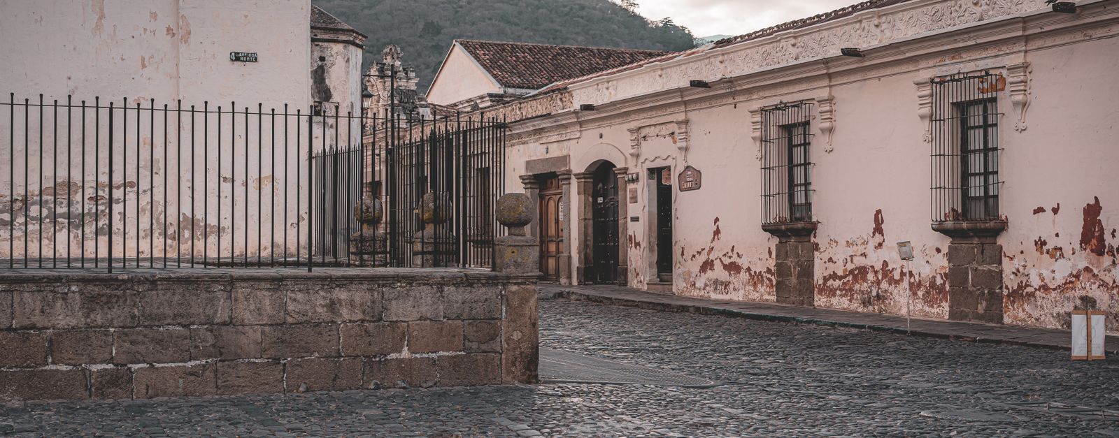 Historic colonial buildings and cobblestone streets in Antigua Guatemala.