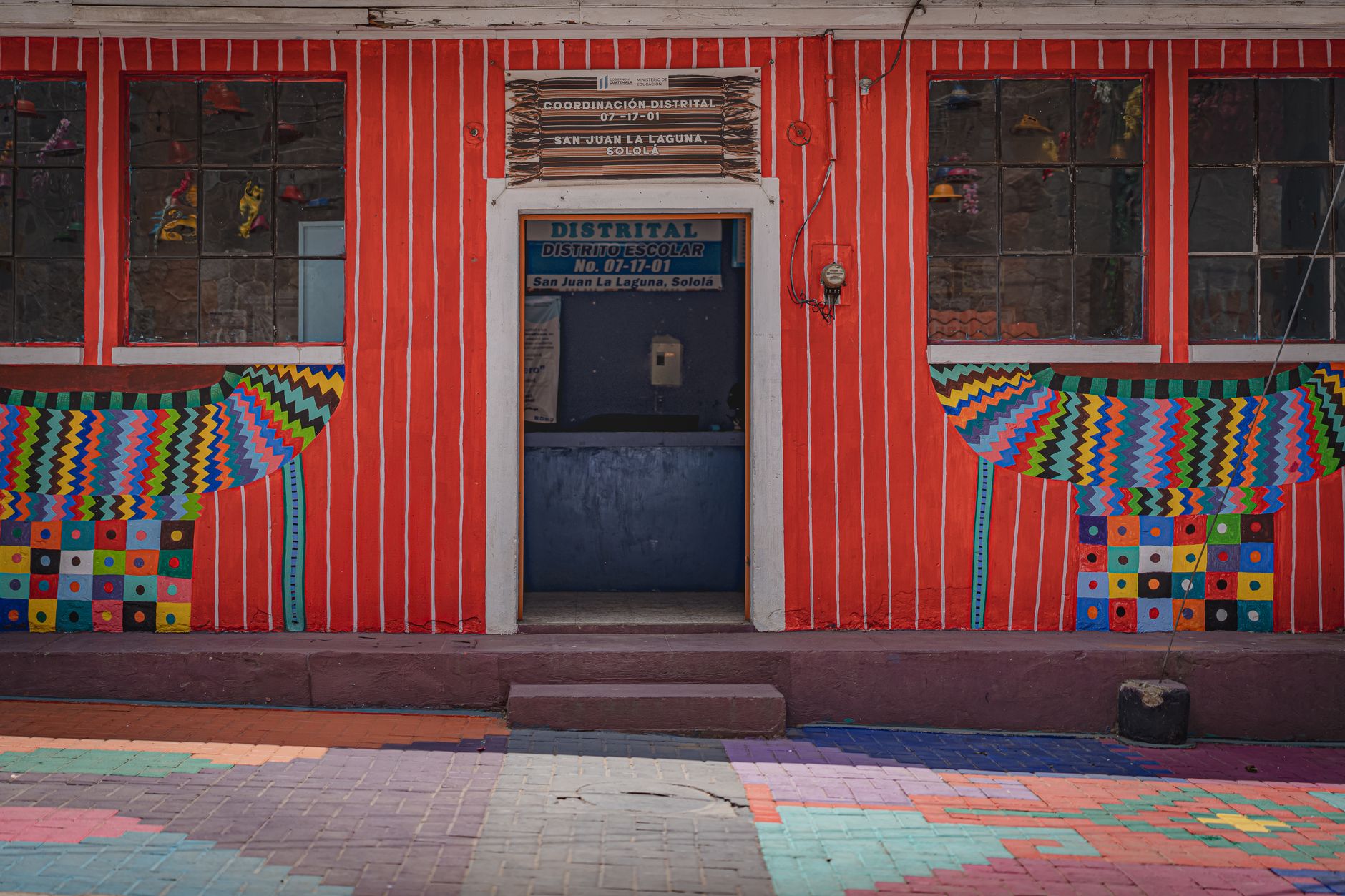 Colorful facade of a school in San Juan La Laguna, Sololá, Guatemala.