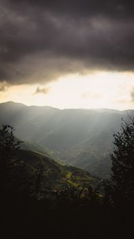 Breathtaking view of Erbaa mountains at sunset with dramatic clouds, capturing nature's beauty.