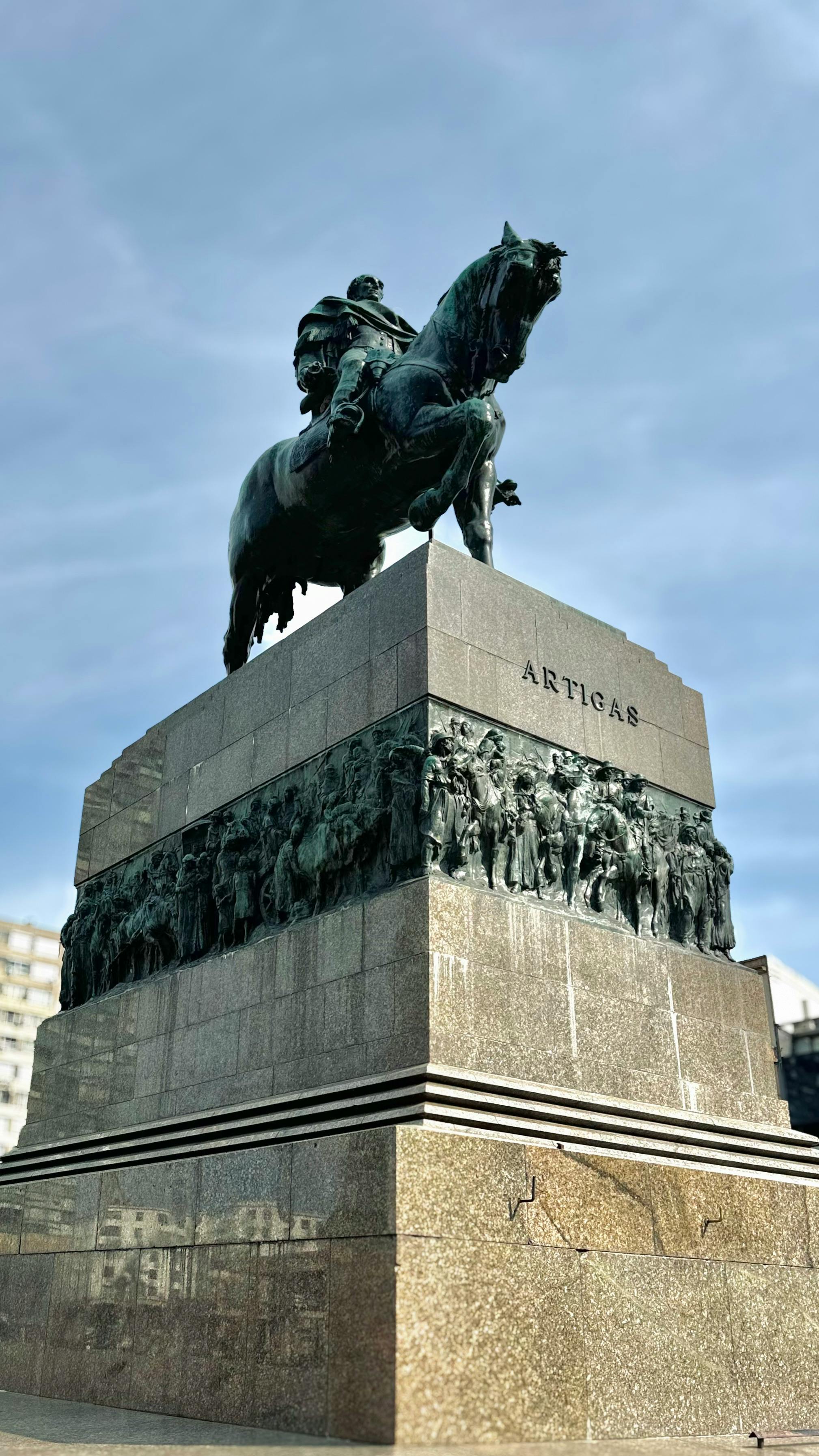 Monument of José Artigas on horseback in Montevideo, against a blue sky.