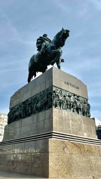 Monument of José Artigas on horseback in Montevideo, against a blue sky.