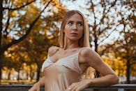 Elegant Woman in Autumn Munich Park