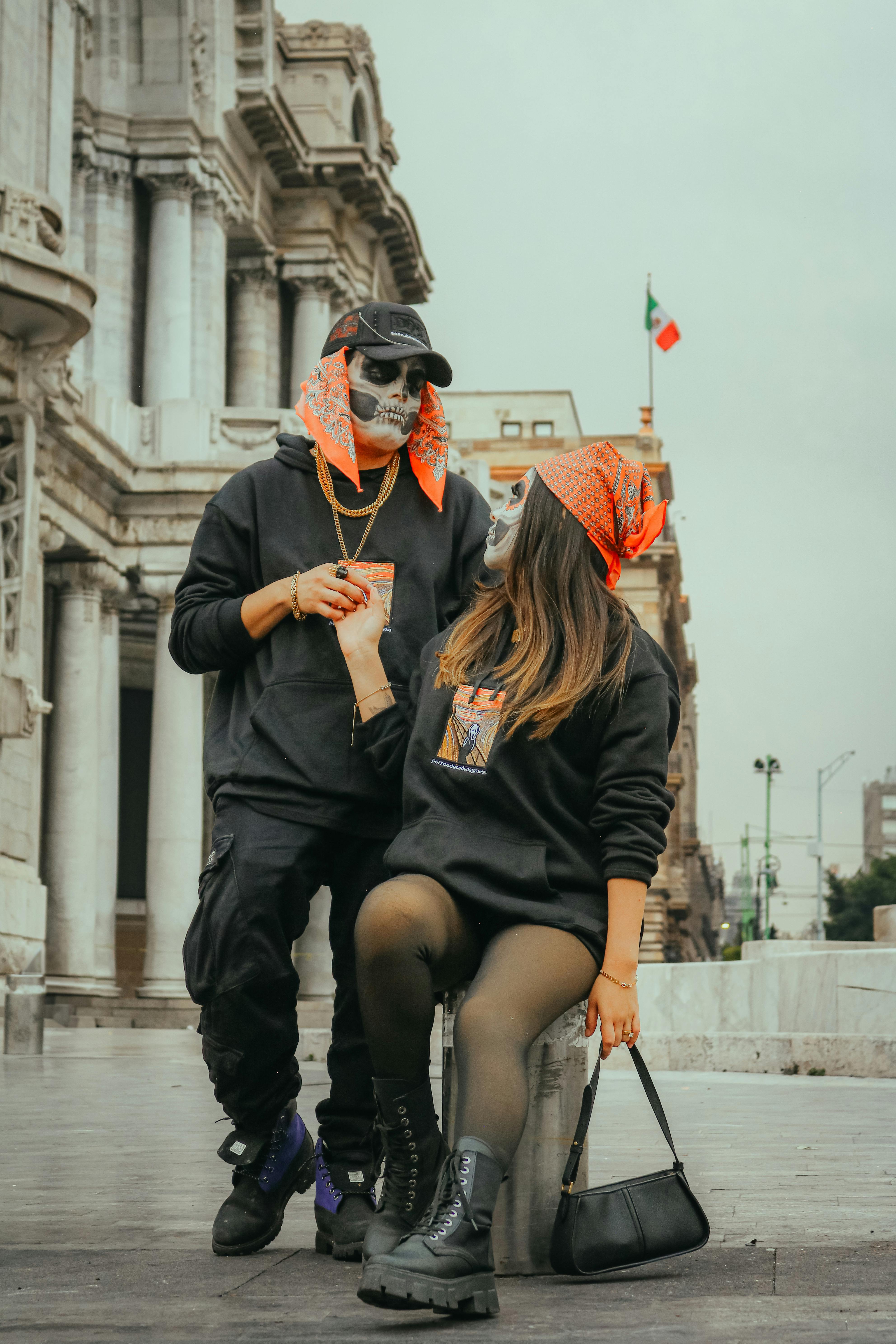 couple in urban streetwear by historic building