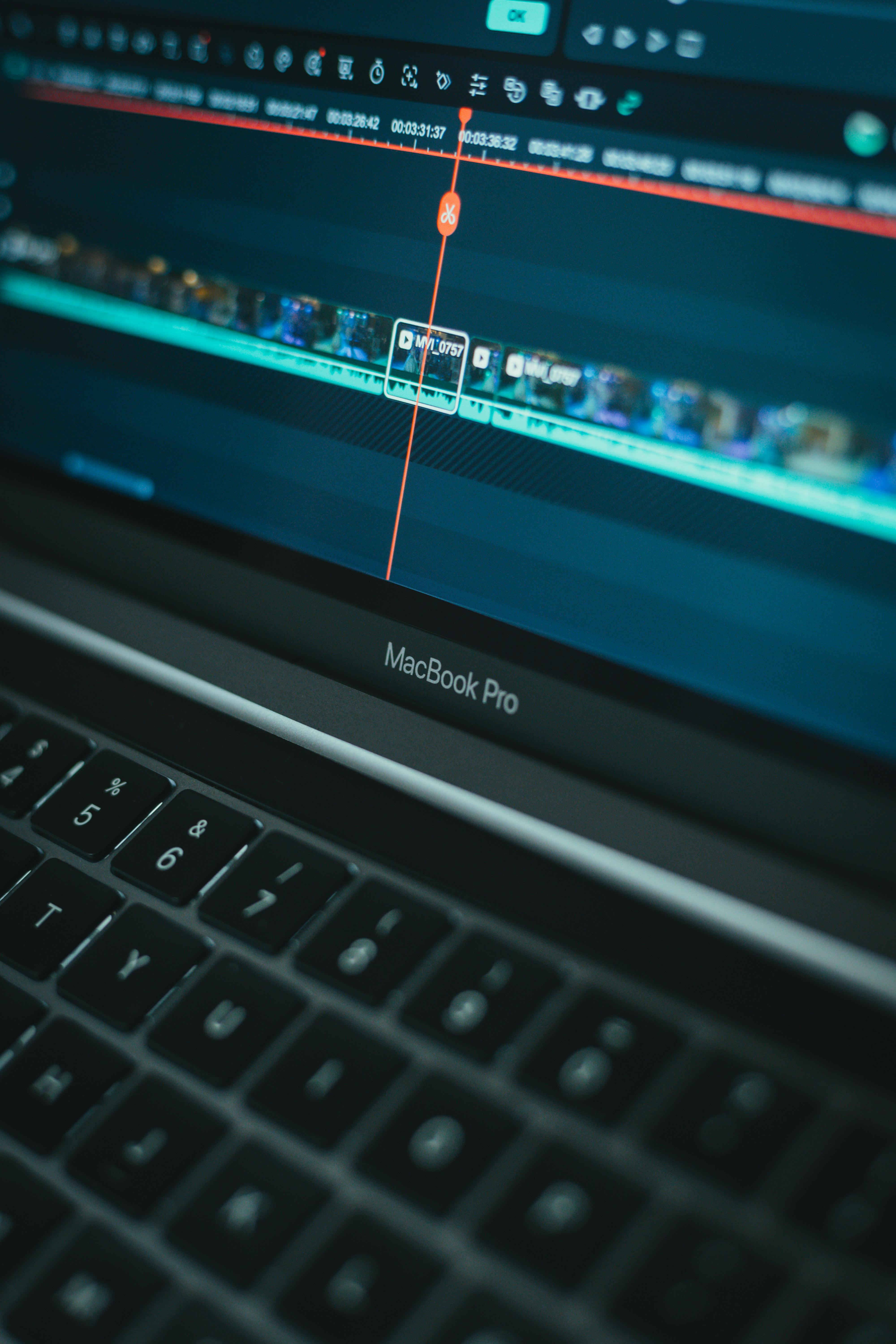 Detailed view of video editing software on a MacBook Pro laptop computer.