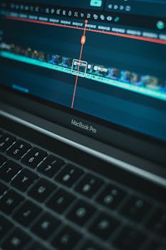 Detailed view of video editing software on a MacBook Pro laptop computer.