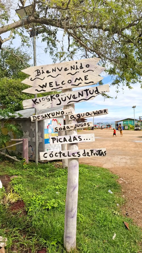 Free Wooden signpost with food and drink options on Taboga Island, Panama. Stock Photo