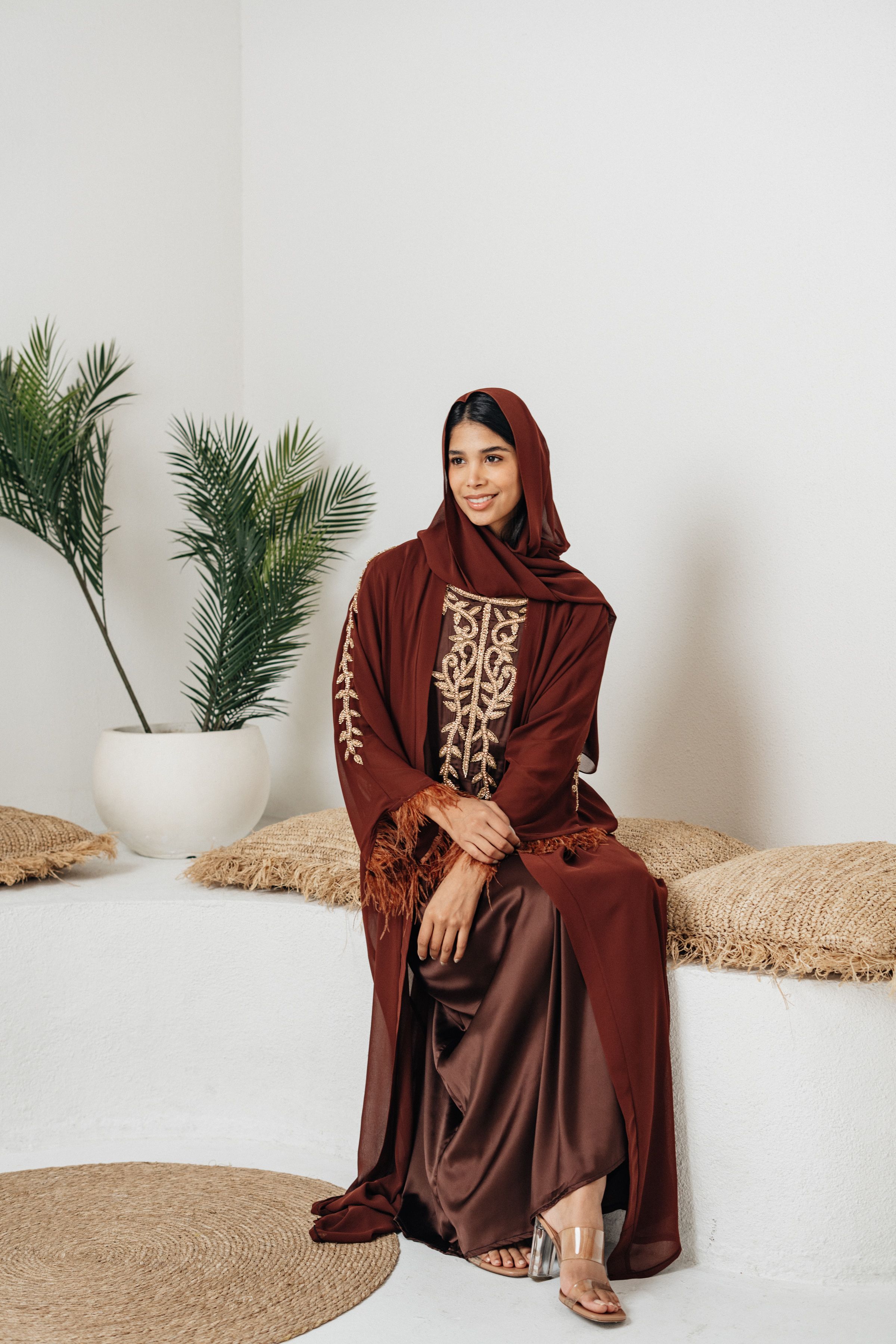Woman layering dress under winter coat