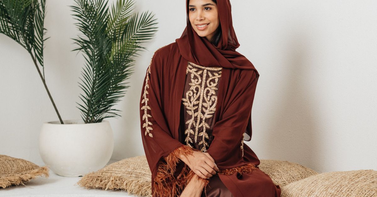 Woman layering dress under winter coat