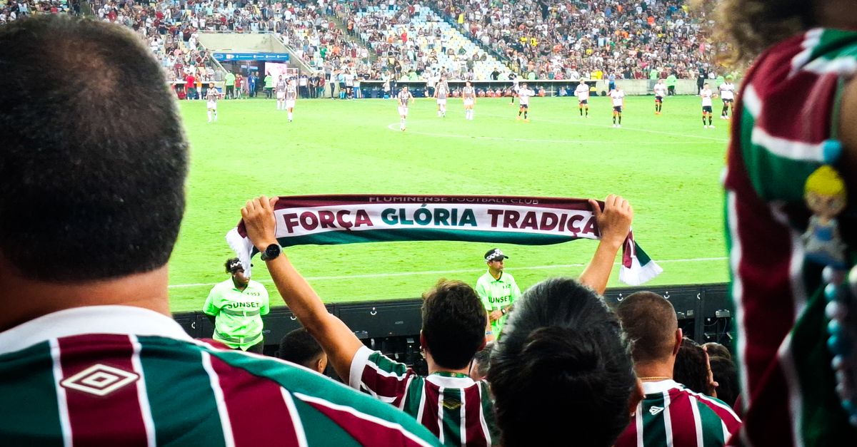 Why do fans collect football scarves?