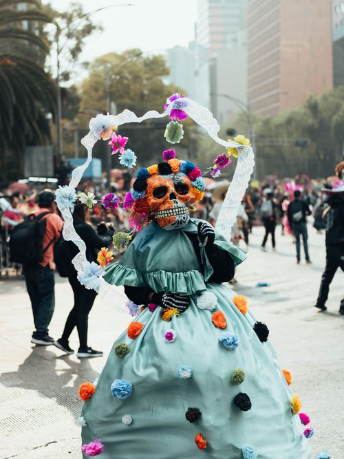 Free A colorful Day of the Dead parade featuring a traditional Catrina in Mexico City. Stock Photo