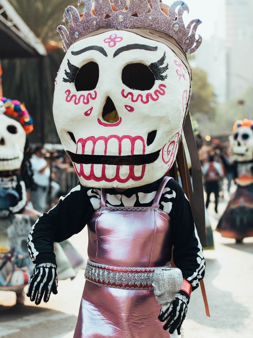 Free Colorful costumes at Mexico City's Day of the Dead parade, celebrating Mexican culture. Stock Photo