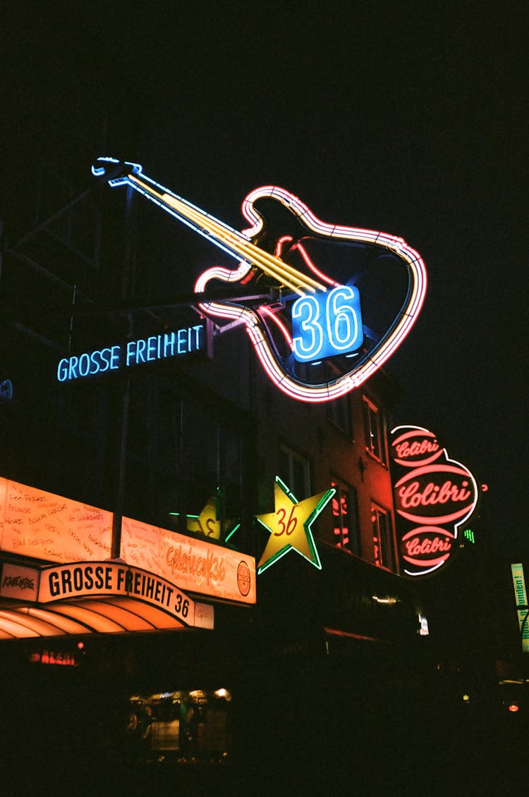 Photo Of Building With Lighted Neon Signages