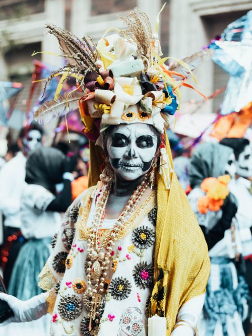 Free Colorful Day of the Dead celebration with traditional attire in Mexico City. Stock Photo