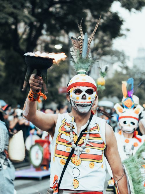 Free Colorful celebration with traditional costumes at Day of the Dead parade in Mexico City. Stock Photo