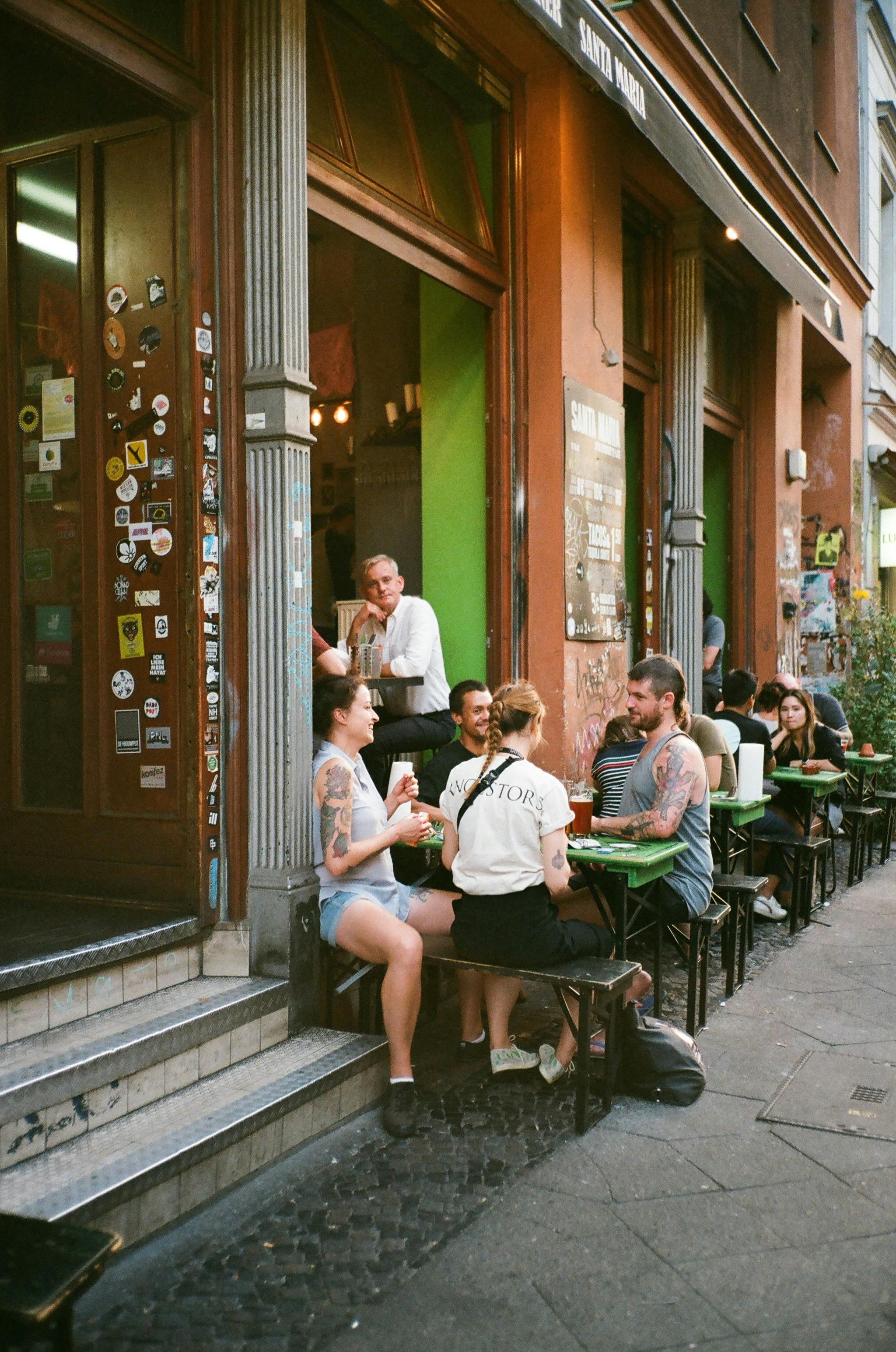 people eating outside the building