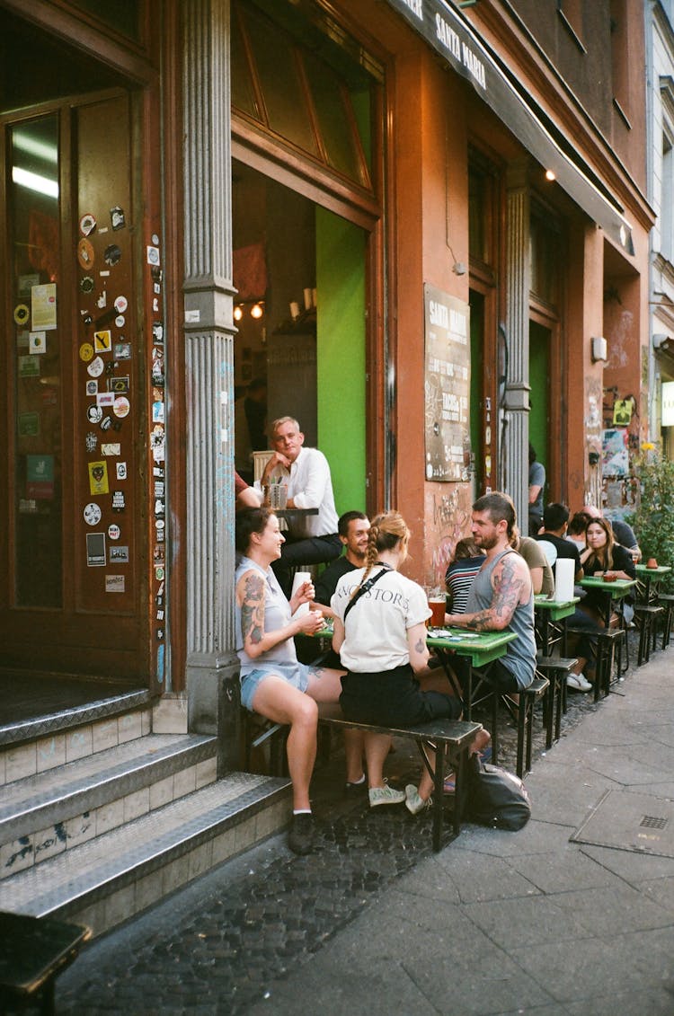 People Eating Outside The Building