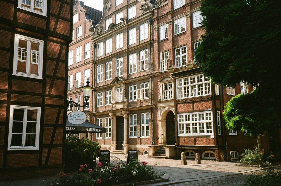 Charming street view of historic European buildings with unique architectural features.