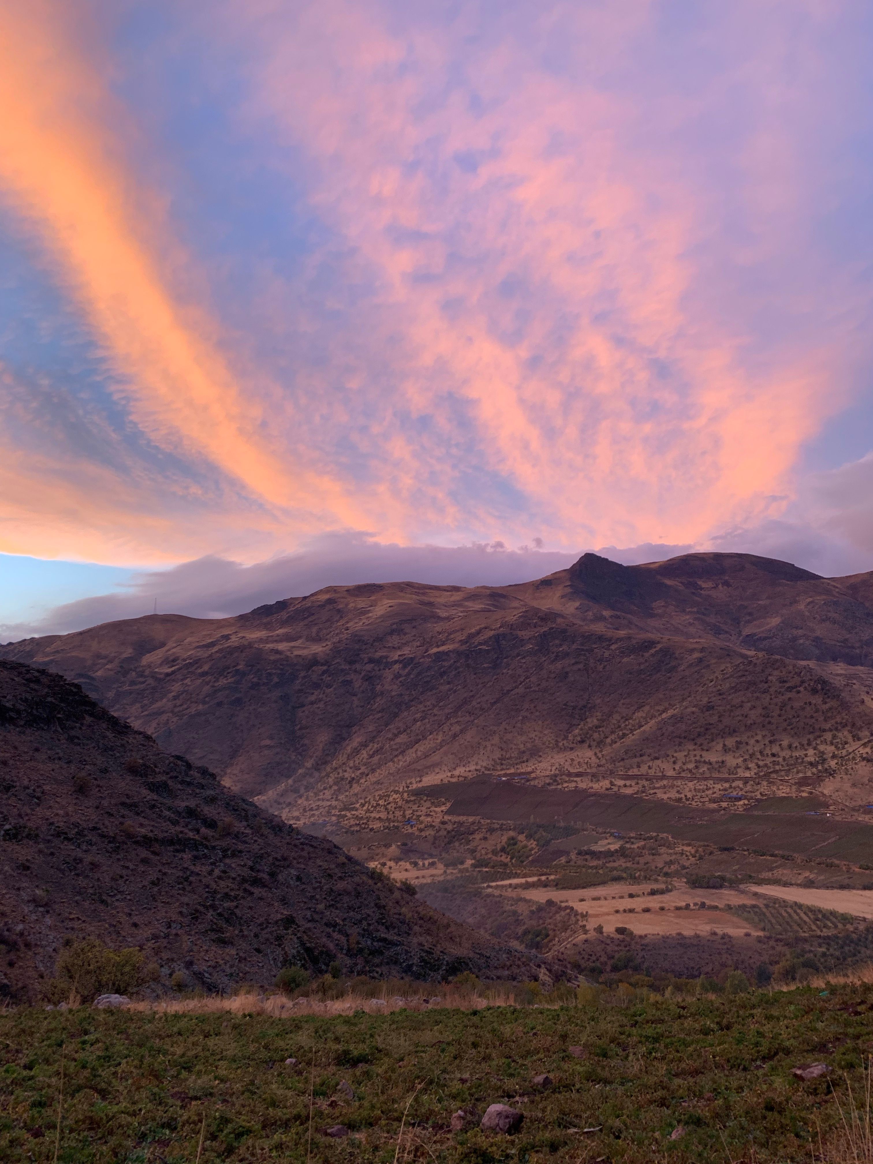Beautiful view of a mountain range under a vibrant sky at sunset, showcasing natural splendor.