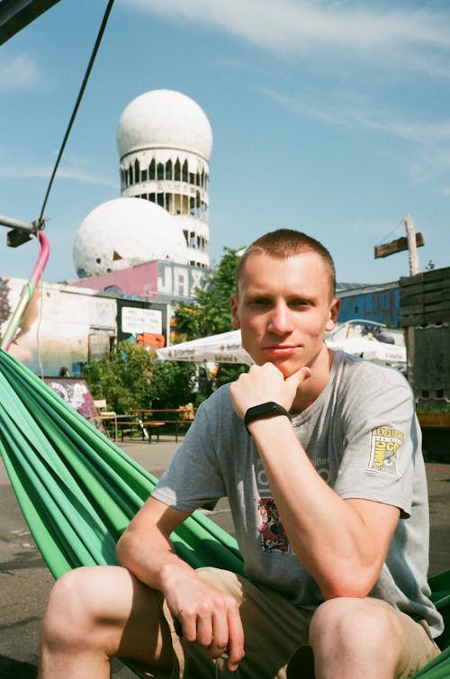 Free Man Sitting on Green Hammock Stock Photo