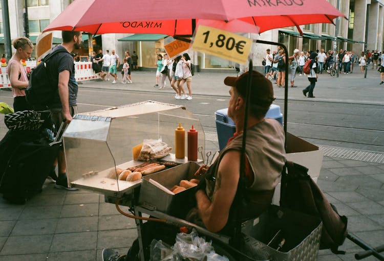 A Street Vendor Watching The People