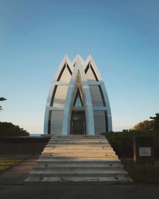 Futuristic chapel design in Bali showcasing a modern architectural style with glass and concrete.