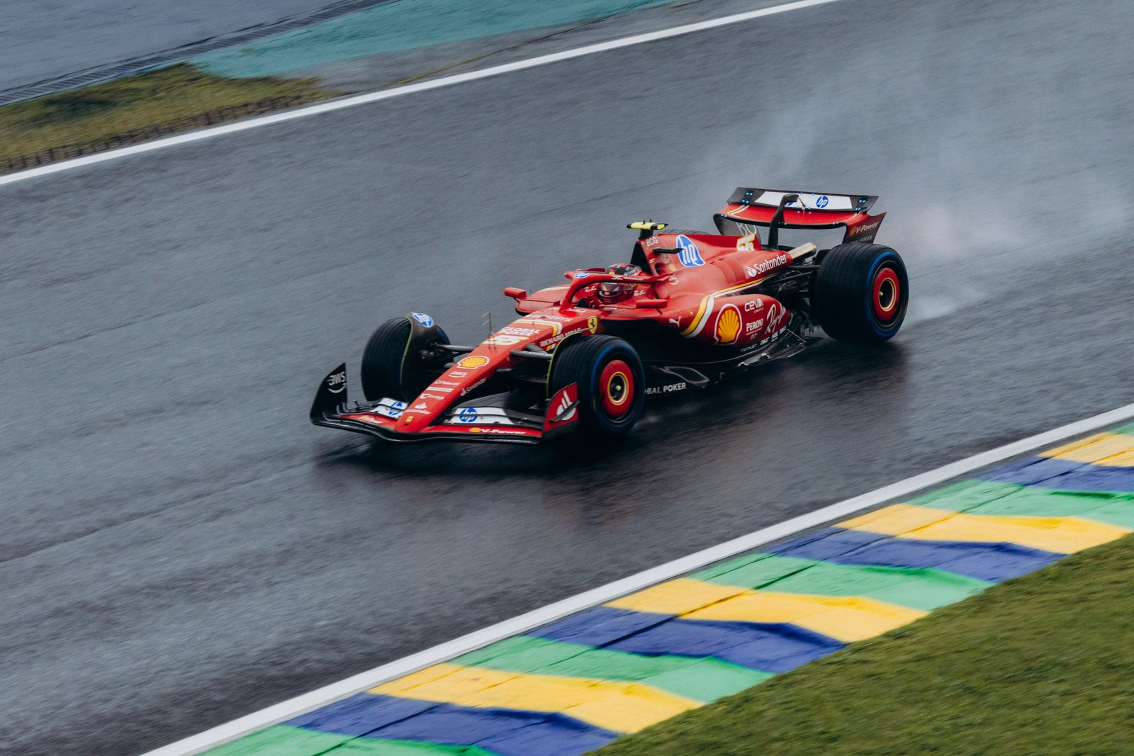 Ferrari Formula 1 Car Racing on Wet Track · Free Stock Photo