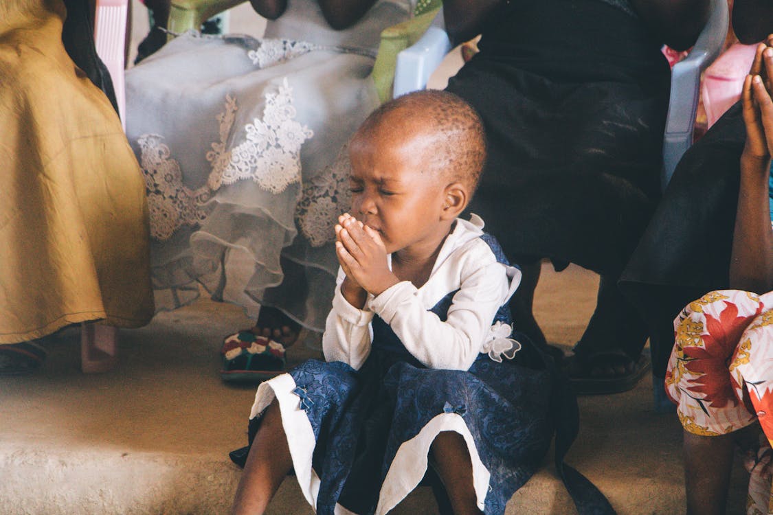 Free Photo of Child Praying Stock Photo