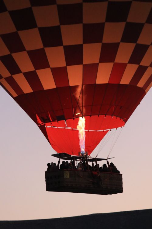 Free Thrilling hot air balloon ride at sunrise in Cappadocia, Turkey, showcasing stunning landscapes. Stock Photo