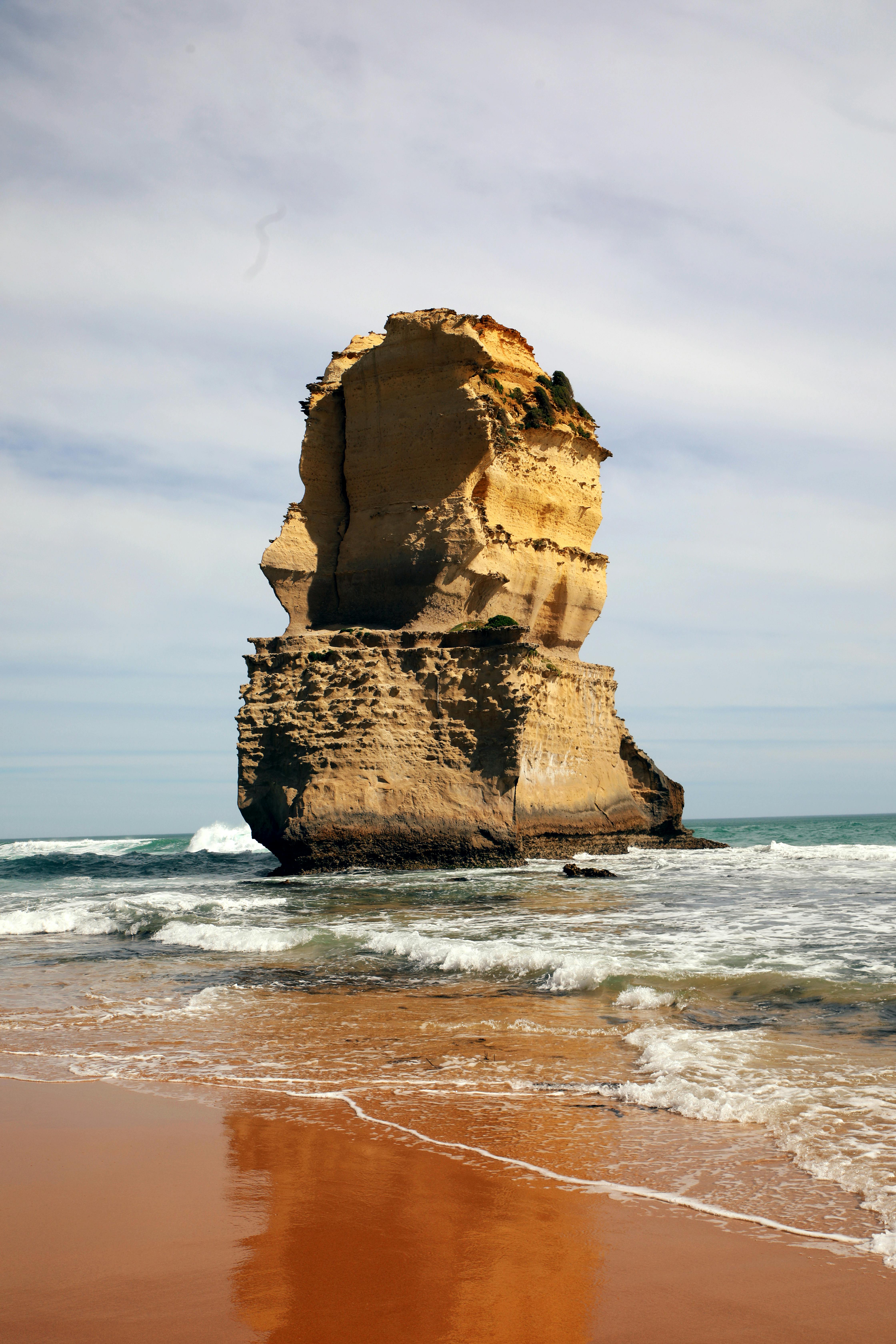 Dramatic Rock Formation Along Ocean Shoreline · Free Stock Photo