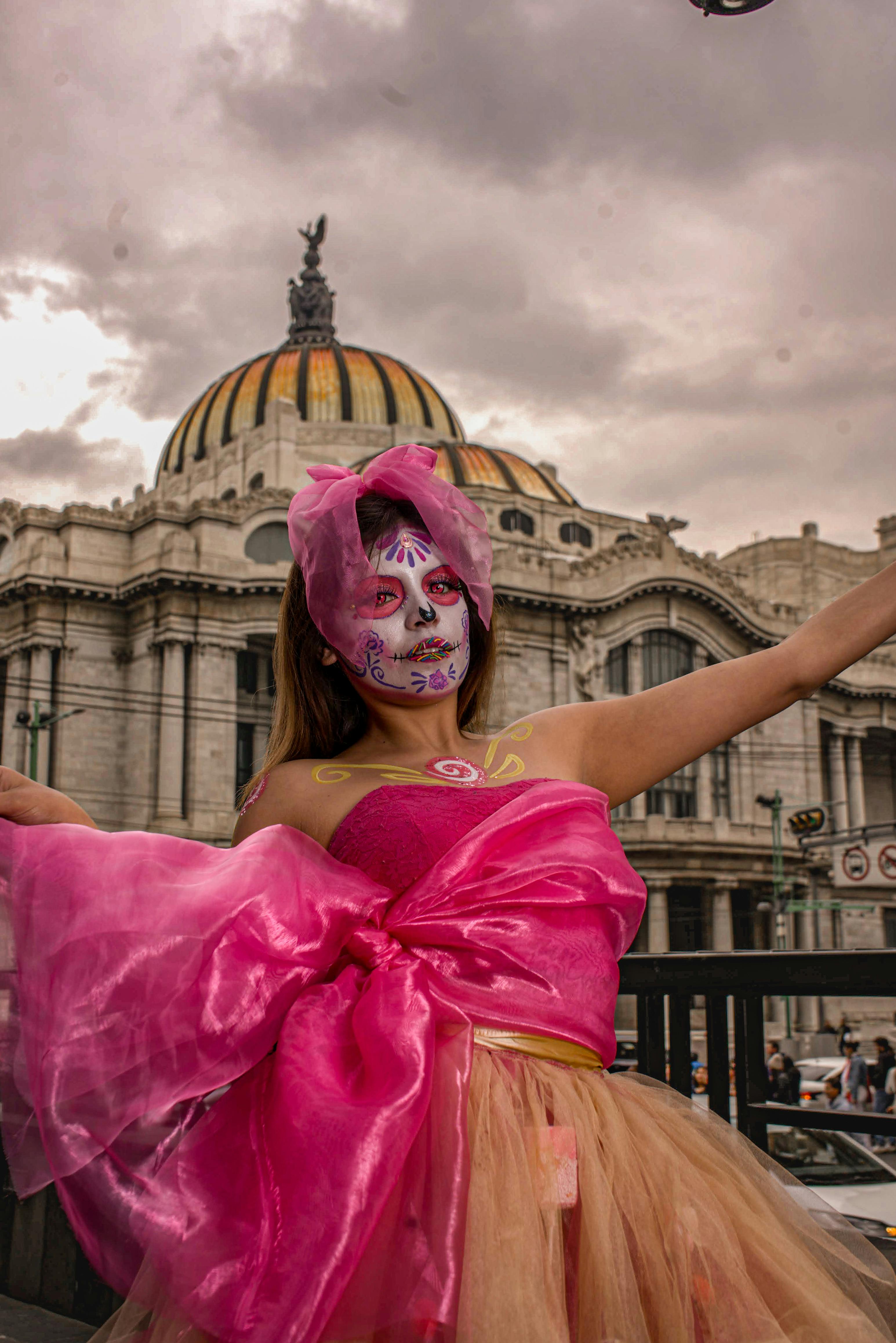 vibrant catrina makeup in front of palacio de bellas artes