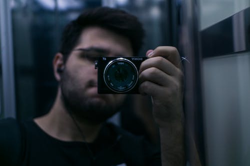 Free stock photo of easphones, lift, mirror