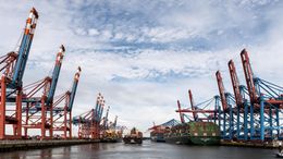 Container ships and cranes at a shipping port — photo by Wolfgang Weiser on Pexels