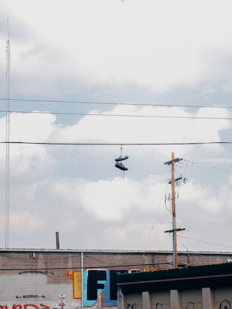 Pair Of Shoes Hanging On Electric Wire